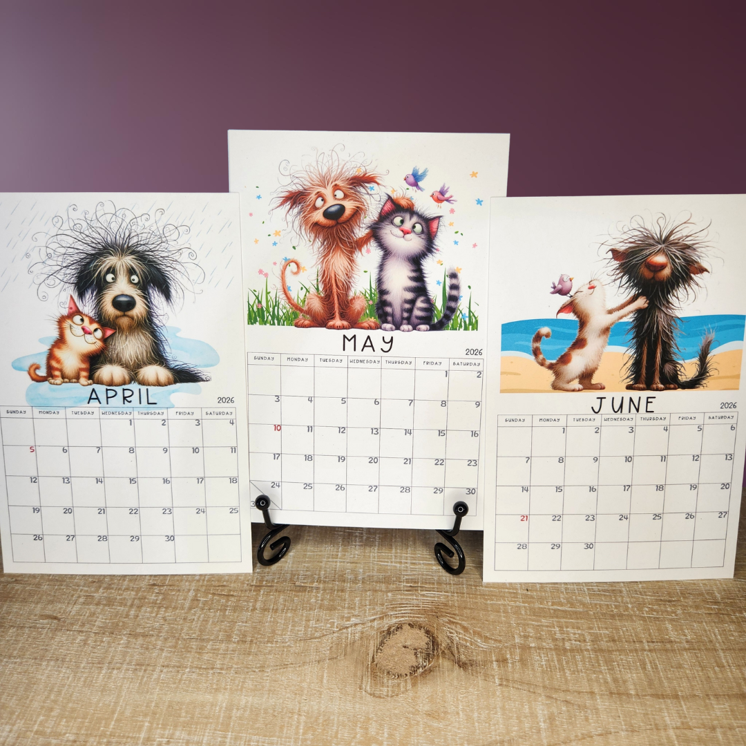 Three wall calendars showing April, May, and June with animal illustrations on a wooden surface.