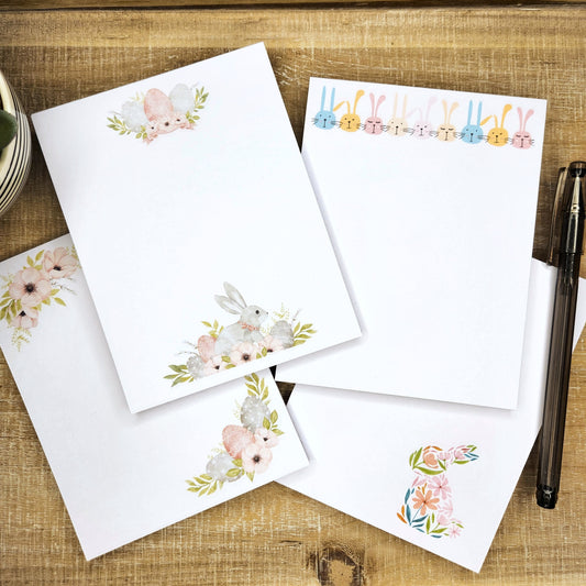 four fun Easter designs on wooden background.