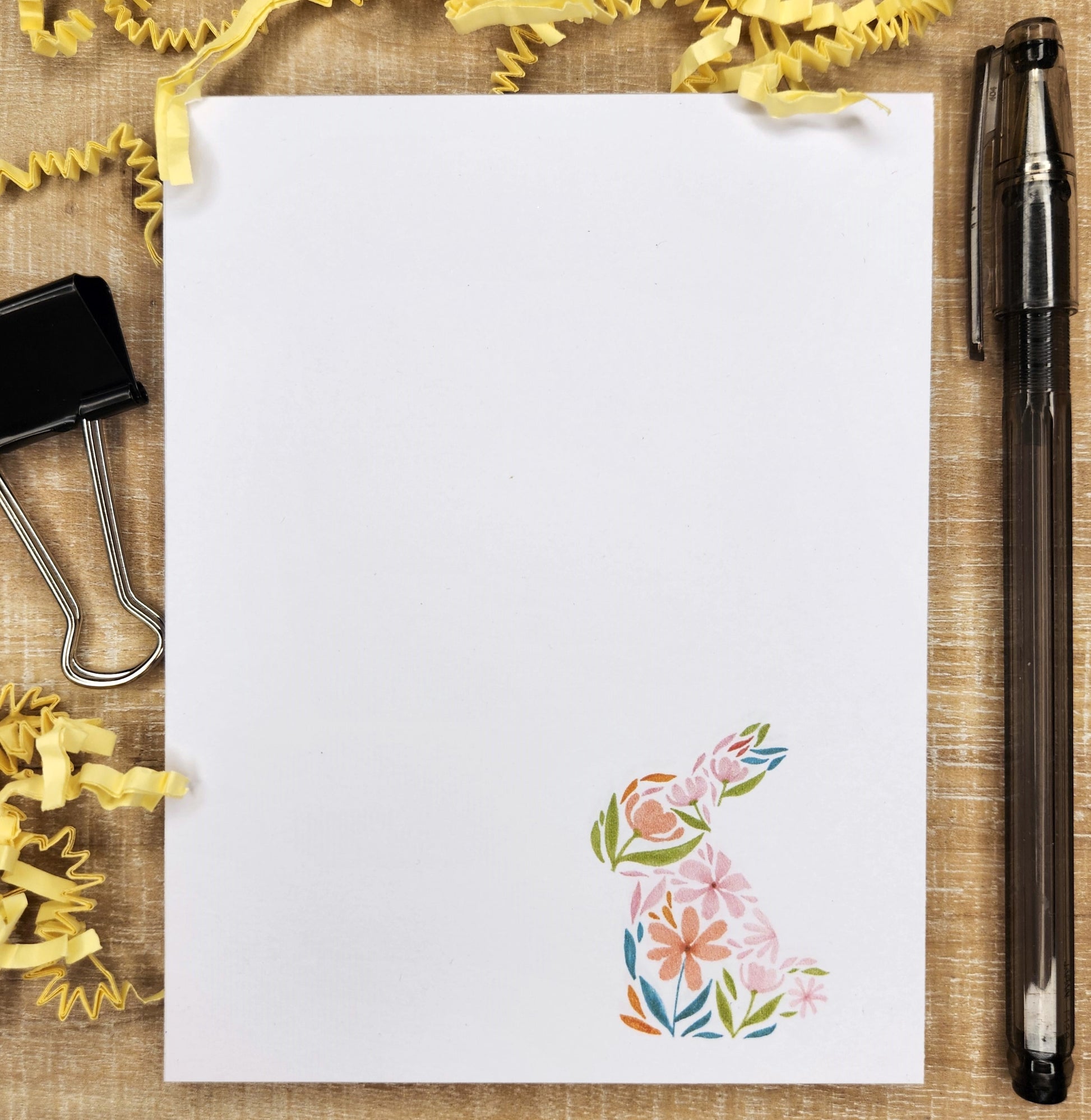 Colorful floral bunny sits on the bottom right corner of each page of this 650 count notepad.