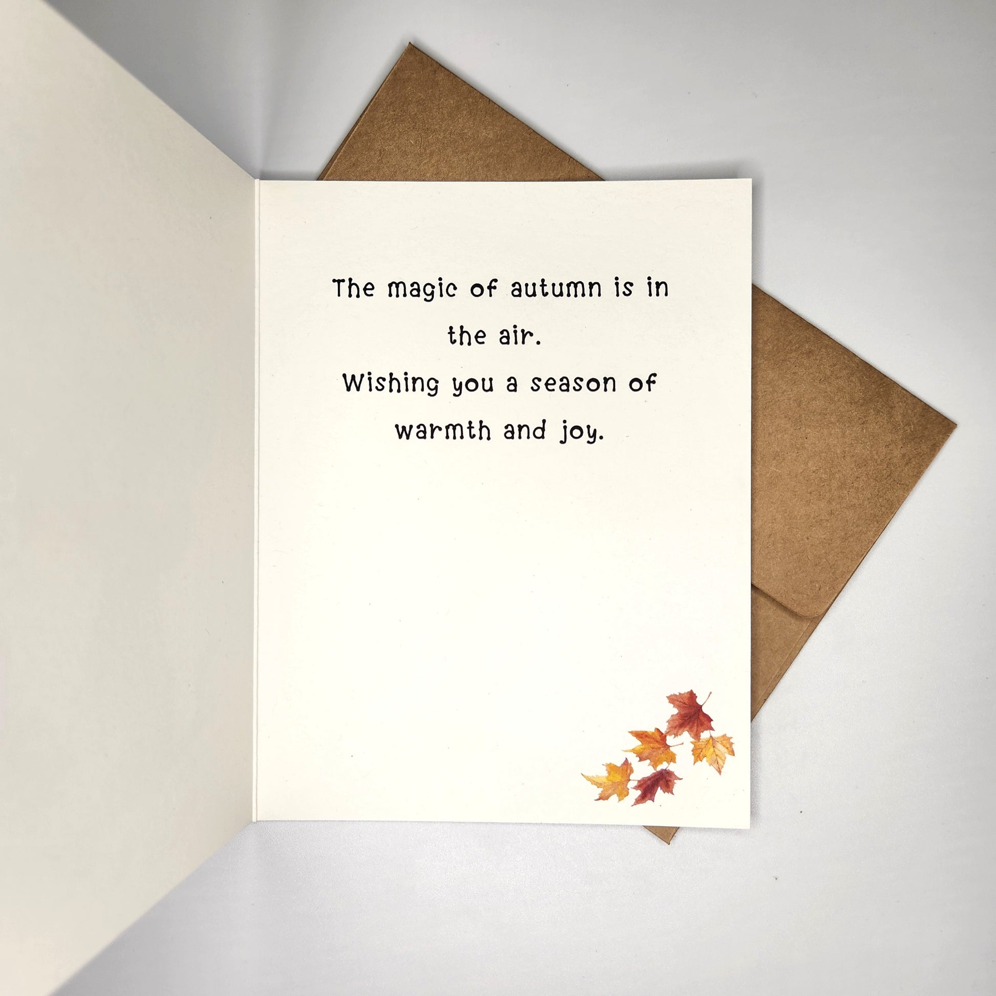 inside of the card showing the option of a verse.  "The magic of autumn is in the air.  Wishing you a season of warmth and joy."