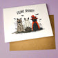 Halloween-themed card with cats dressed as a mummy, ghost, and witch on a purple background.