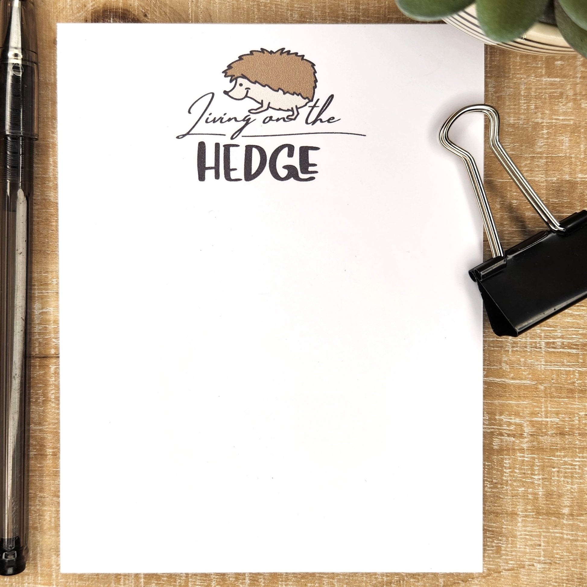 living on the hedge is written on the top of the page and a cute little hedgehog is smiling down at the words. 