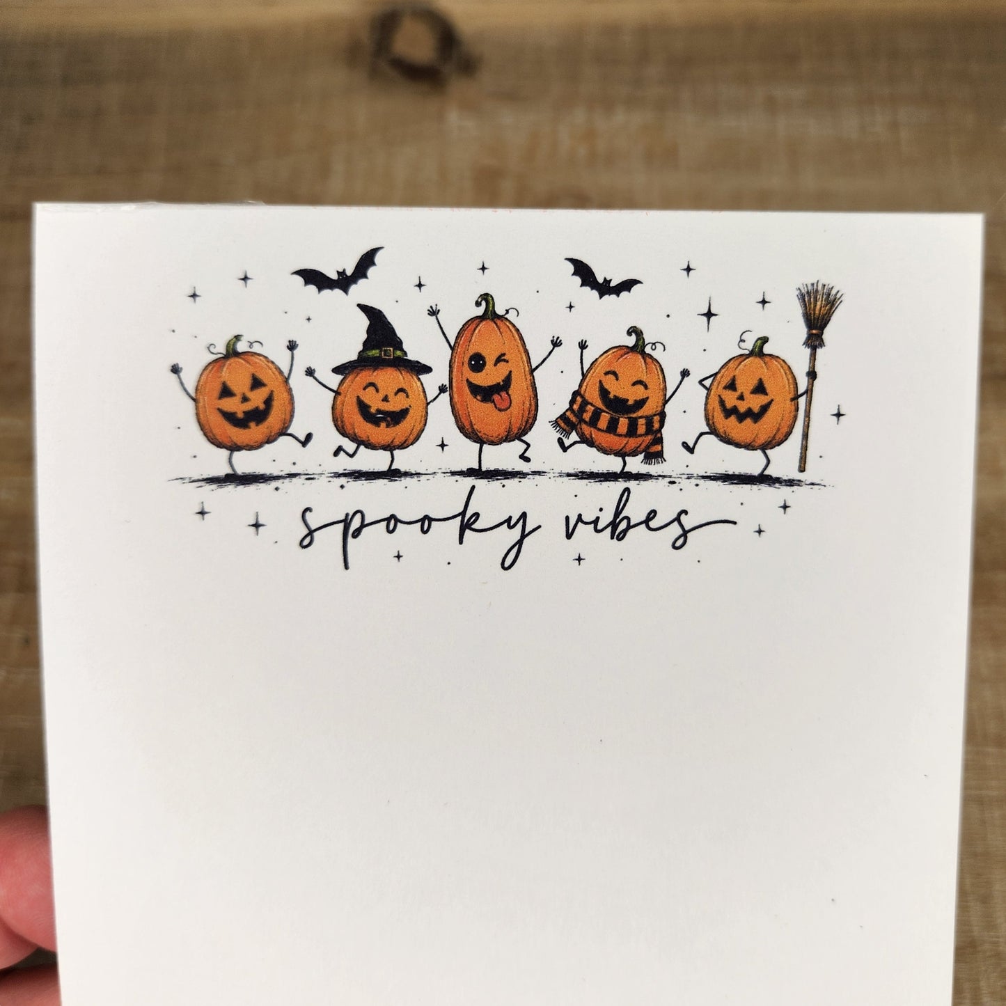 close up of dancing pumpkins at the top of the pages.
