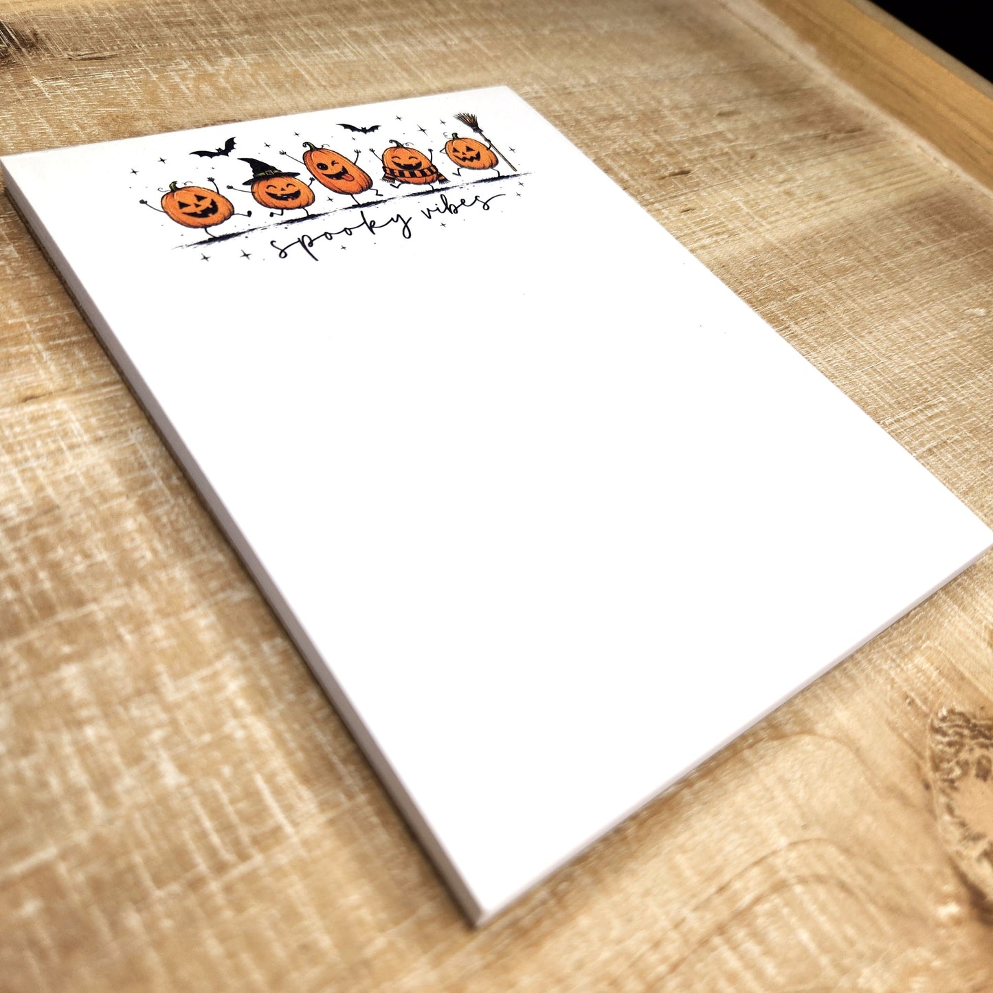 side view of the notepad depicting the size of the notepad.  4.25x5.5 inches 